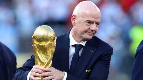 Infantino with the World Cup trophy