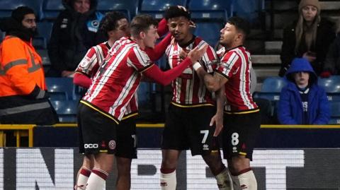 Sheffield United players celebrate after Rhian Brewster scores