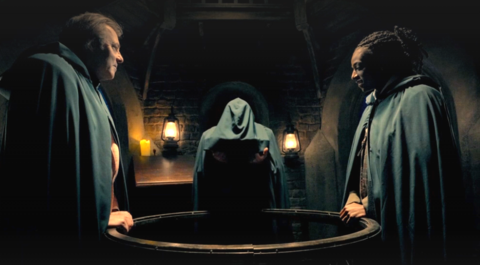 Cloaked figures