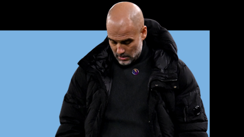Pep Guardiola looks down