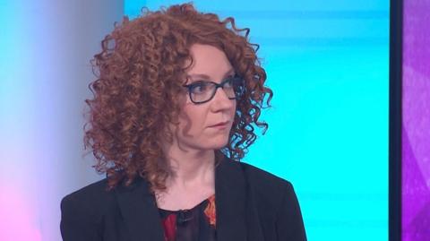 A woman 'Kate Elysia' in the Newsnight studio