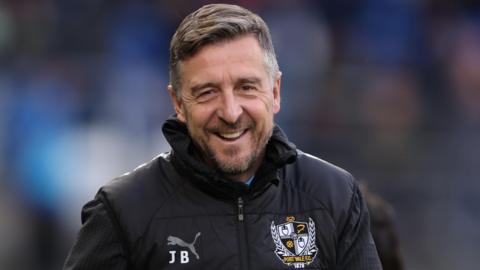 Jon Brady Port Vale manager smiles after a match
