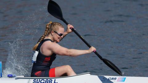 Laura Sugar races in her canoe