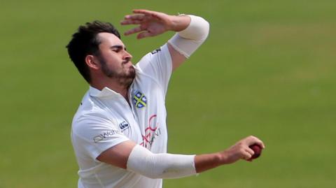 Mitchell Killeen bowling for Durham