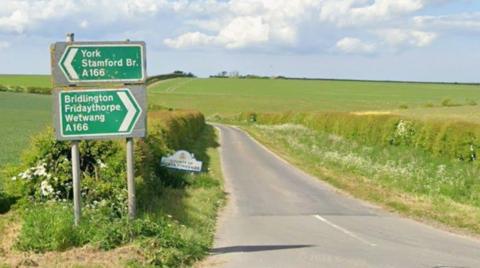 A screenshot from Google maps of a junction off the A166 - a road with fields on either side.