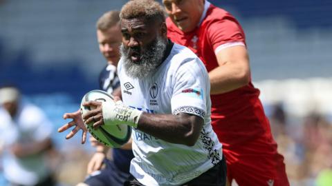  Pita-Gus Sowakula of Fiji races in to score try