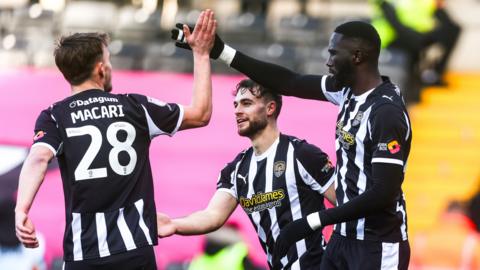 Alassana Jatta celebrates scoring Notts County's winner against Crewe with Lewis Macari