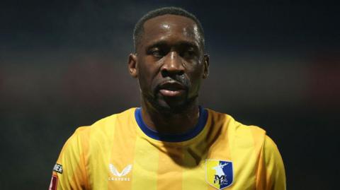 Mansfield Town striker Lucas Akins in action during a game