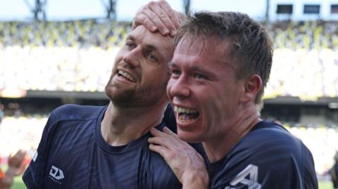 hristian Gray #4 of Auckland City FC celebrates with Jordan Vale #14 during the FIFA Club World Cup 2025 group C match between Auckland City FC and CA Boca Juniors