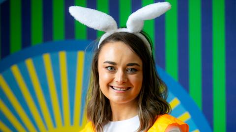Beth wearing white rabbit ears