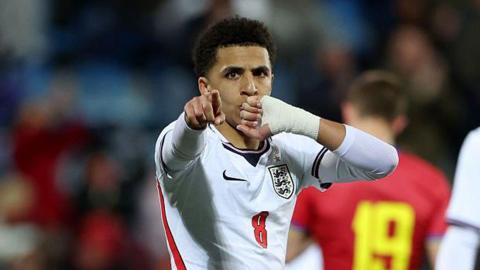 Rico Lewis celebrates scoring for England