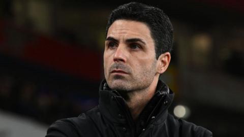 Mikel Arteta looks on thoughtfully