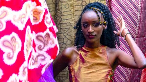 A model poses at a fashion show.