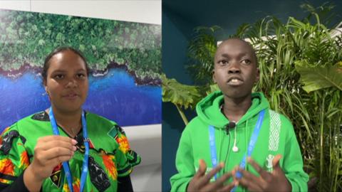 Two children in green tops at the COP29 event