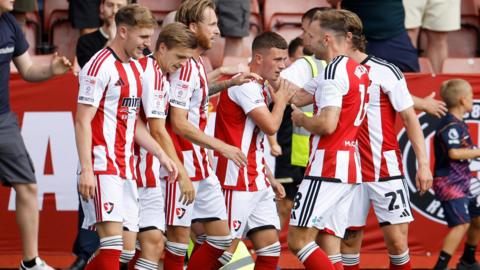 Jake Evans celebrates