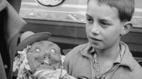 Boy with his Guy Fawkes effigy