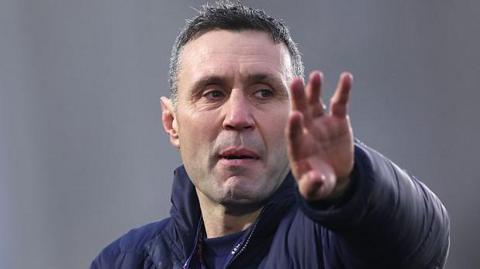 Newcastle Red Bulls head coach Stephen Jones makes a point as he oversees a warm-up session