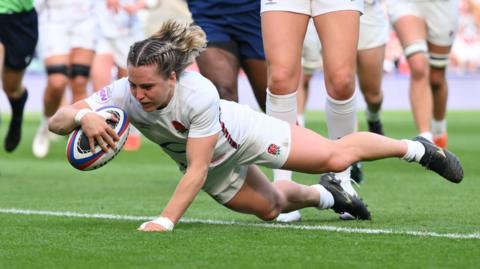 Claudia MacDonald scores a try for England