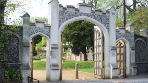 A stone gate including the wooden gates on the outskirts of the gardens.