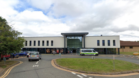 Princess Royal Hospital, a white rendered building with a glass frontage