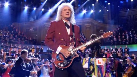 Brian May playing guitar at BBC Proms.