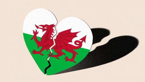 An edited image of a broken heart shape featuring the Welsh flag