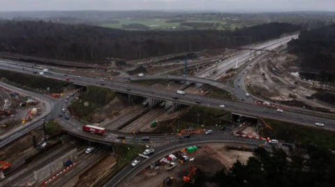 An aerial view of the junction of the M25 and A3 in Surrey.