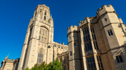 Image of the Wills Memorial Building in Bristol, with bright blue skies behind it.