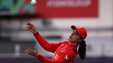 England's Maia Bouchier spills a catch on the boundary