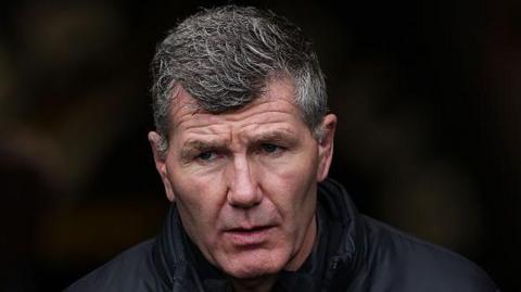 Exeter Chiefs director of rugby Rob Baxter looking on before his side's match against Munster.