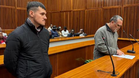 Adrian de Wet, left, is seen wearing a black jacket while Zachariah Olivier is seen in a grey jacket in court