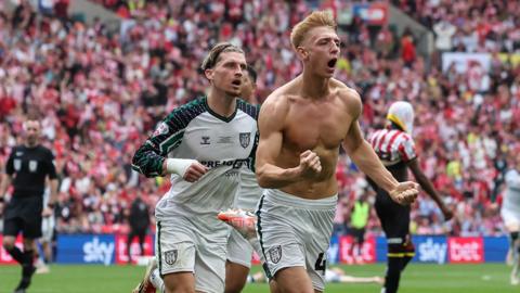 Dennis Cirkin and Tommy Watson celebrate Sunderland's second goal against Sheffield United in the Championship play-off final.