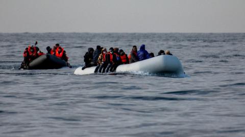 Two small inflatable boats in the Channel