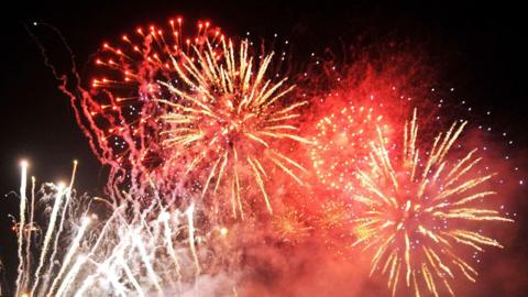 Generic photograph of white and red fireworks