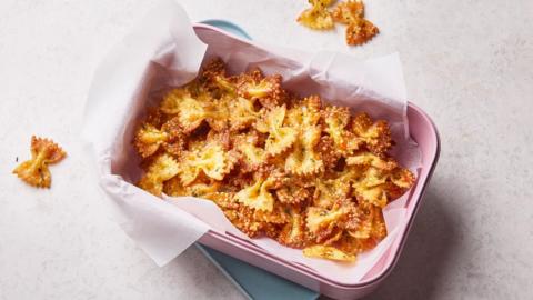 Crispy air fryer pasta in a pink baking dish