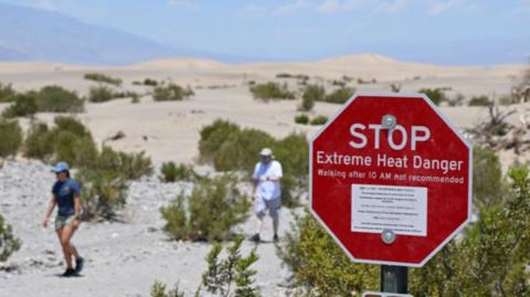 STOP Extreme Heat Danger warning sign in Death Valley, USA