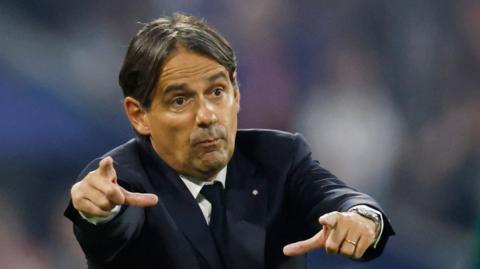 Coach Simone Inzaghi signals to his Inter Milan players during the 2025 Champions League final