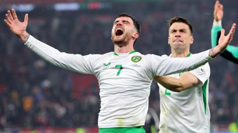 Troy Parrott and Seamus Coleman celebrate the Republic of Ireland's victory over Hungary in Budapest.