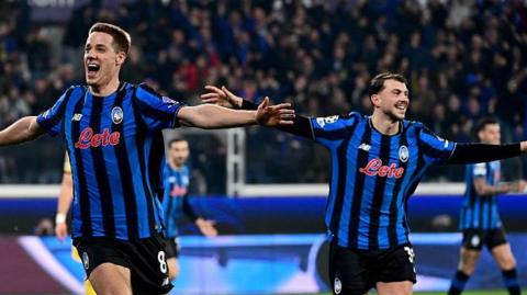 Atalanta players celebrate scoring against Dortmund