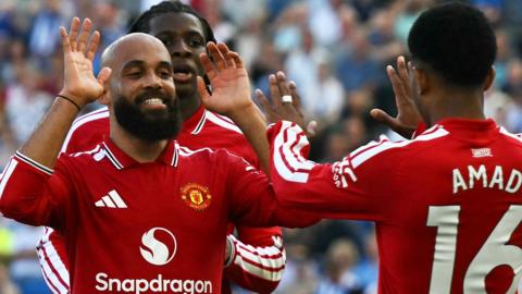 Bryan Mbeumo celebrates a goal for Manchester United with Amad Diallo