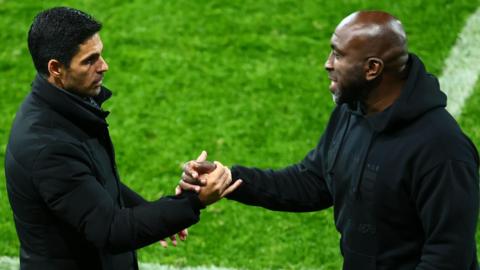 Arsenal head coach Mikel Arteta, on the left, and Port Vale manager Darren Moore shake hands at the end of the Gunner's 2-0 Carabao Cup win