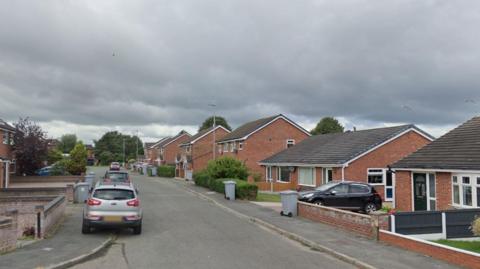 Heron Crescent in Crewe. A Google Maps image. Homes and cars can be seen. 