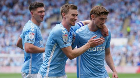 Coventry players congratulate Jack Rudoni for scoring