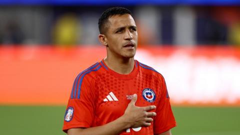 Alexis Sanchez puts his hand over his heart while in Copa America action for Chile