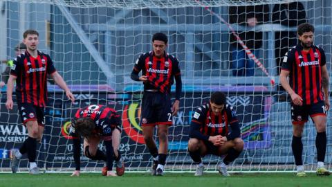 Truro's players cut forlorn figures after losing late on yet again