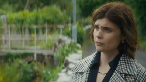 Death Valley character, DS Janie Mallowan, stands in a garden looking confused