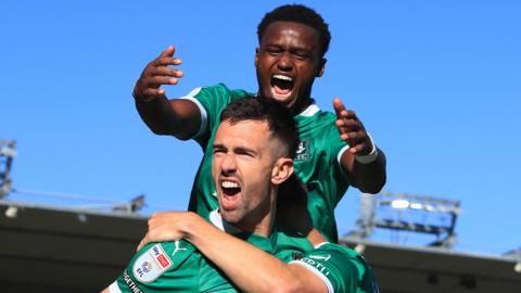 Plymouth players celebrate