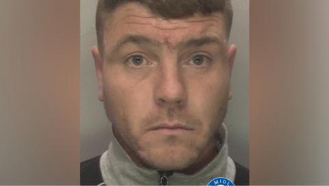 Adam Turner facing the camera in a photo issued by West Midlands Police. Part of the force's logo is showing at the bottom.