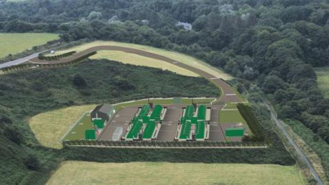 A CGI of eight dark green sheds in a large field with trees around them.