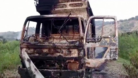 A charred vehicle is seen after separatist militants conducted deadly attacks  in Balochistan province, Pakistan.